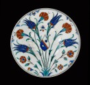 Dish with flower sprays and coat of arms, Turkey (Iznik), c.1570, Presented by C. D. E. Fortnum, 1888 (Museum no: WA1888.CDEF.C324) [image only].