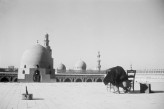 Creswell photographing on the rooftop of the Mosque of Ibn Tulun, Cairo, in 1960., Photo by: Dr Christel Kessler. © Ashmolean Museum, University of Oxford