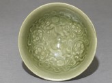 Greenware bowl with boys amid peony scrolls