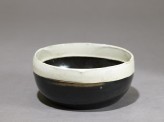 Black ware bowl with white rim
