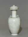 Greenware vase with floral decoration