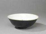 Black ware bowl with white interior and black exterior