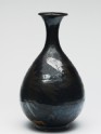 Black ware bottle with floral decoration