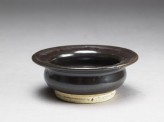 Black ware bowl with iron glaze