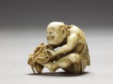 Netsuke in the form of a man making a mat