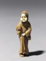 Netsuke in the form of a figure wearing a mask of Okame, a merry Shinto goddess