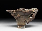 Rhinoceros horn libation cup with bronze-style decoration