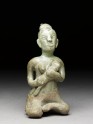 Greenware figure of mother and child