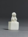 Porcelain seal surmounted by a seated animal