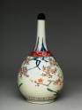 Bottle with flowering prunus and peach trees