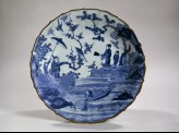 Foliated dish with figures in a landscape