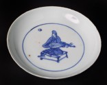 Blue-and-white dish with seated musician playing a lute