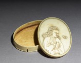 Ivory box with figure holding a fan