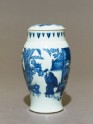 Blue-and-white jar and lid with couple in a garden