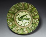 Bowl with bird and spotted leaves