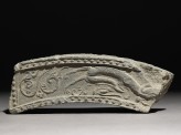 Fragment of a roof-tile with running dragon