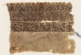 Textile fragment with quatrefoils and interlacing kufic script (EA1984.108)