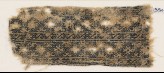 Textile fragment with linked diamond-shapes and interlaced crosses (EA1984.203)
