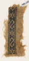 Textile fragment with S-shapes and rosettes