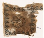 Textile fragment with rosette and palmettes, possibly from a cushion (EA1984.40)