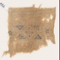 Textile fragment with band framed by triangles