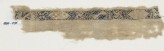Textile fragment with band of cartouches, spirals, and stars