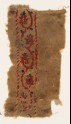 Textile fragment with vine and flower-heads (EA1984.82)