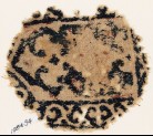 Textile fragment with tab shape, plant, and vine (EA1984.94)