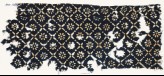 Textile fragment with flowers, dots, and rosettes