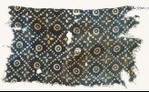 Textile fragment with dots, quatrefoils, and circles