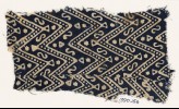 Textile fragment with large chevrons, dots, S-shapes, and stars (EA1990.156)