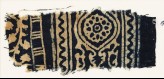 Textile fragment with medallion, and a vine with leaves and flowers (EA1990.198)