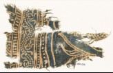 Textile fragment with dotted vine and part of a design of arches (EA1990.232)