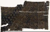 Textile fragment with rosettes, squares, and part of two medallions (EA1990.246)