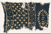 Textile fragment with vines, dots in a grid, and probably a leaf (EA1990.261)