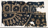 Textile fragment with trees, stars, and radiating shapes (EA1990.262)