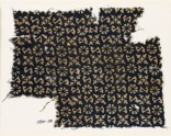Textile fragment with S-shapes, rosettes, and quatrefoils (EA1990.28)