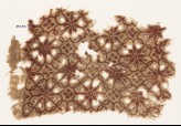 Textile fragment with interlocking floral shapes (EA1990.301)