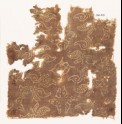 Textile fragment with stylized plants and quatrefoils