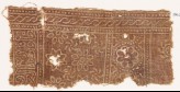 Textile fragment with rosettes and inscription (EA1990.334)
