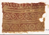 Textile fragment with stepped squares, cable pattern, and flowers