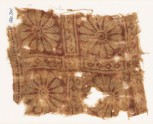 Textile fragment with rosettes in a grid
