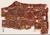 Textile fragment with leaves and flower-heads, possibly from a garment