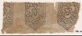 Textile fragment with tab-shapes, trefoils, and dots (EA1990.445)