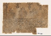 Textile fragment with tendrils forming interlace (EA1990.455)