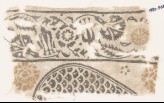 Textile fragment with carnations and tulips, and part of a tear-drop (EA1990.468)
