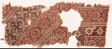 Textile fragment with rosettes, serrated crosses, stars, and dots (EA1990.525)