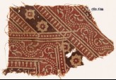 Textile fragment with bands of dotted vines, rosettes, and diamond-shapes (EA1990.538)