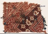 Textile fragment with stylized vine, rosettes, and diamond-shapes (EA1990.539)