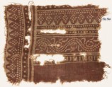 Textile fragment with dotted vine and rhombic shapes